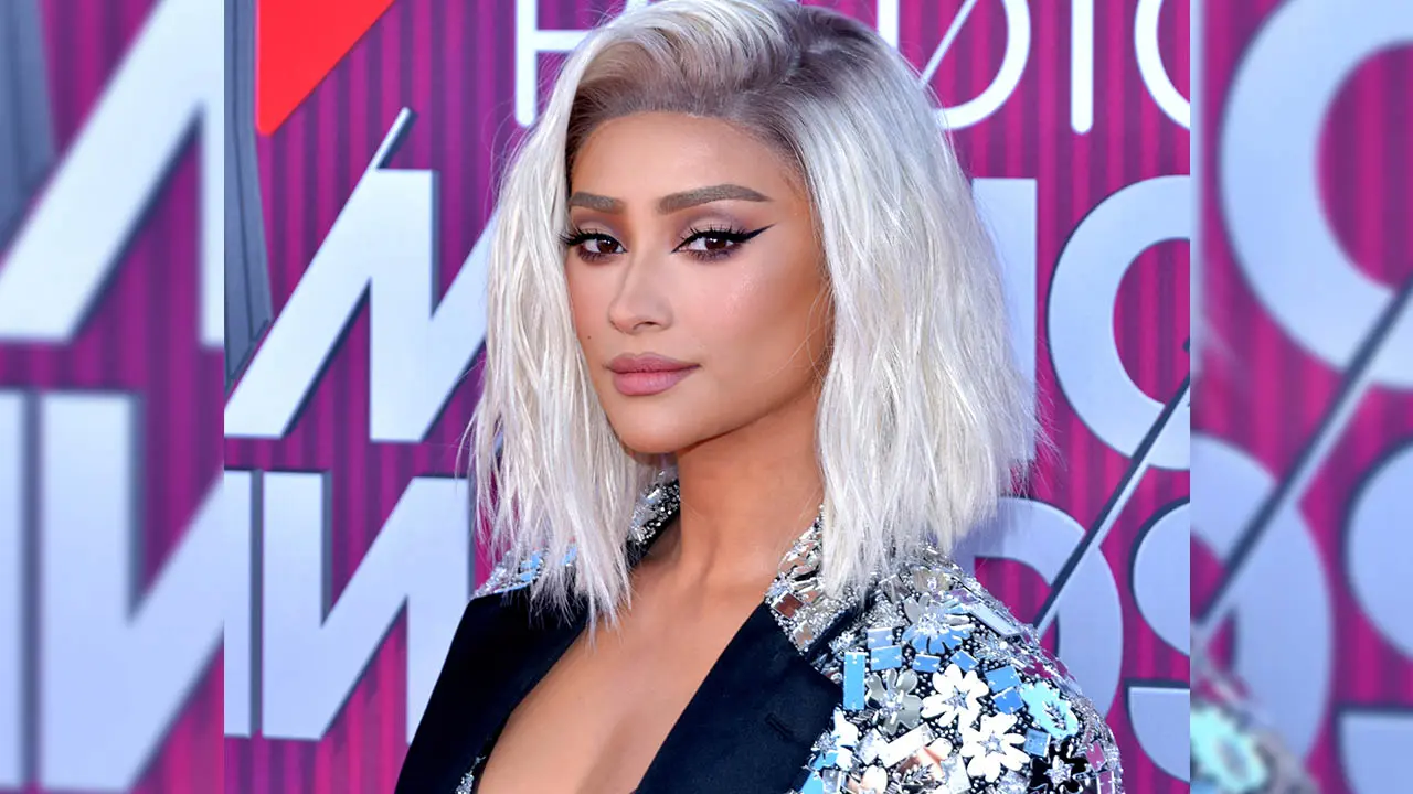 Shay Mitchell's topless pic with baby has people questioning about the father