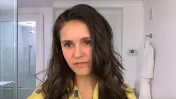 Nina Dobrev flexes pink bra to promote breast cancer research