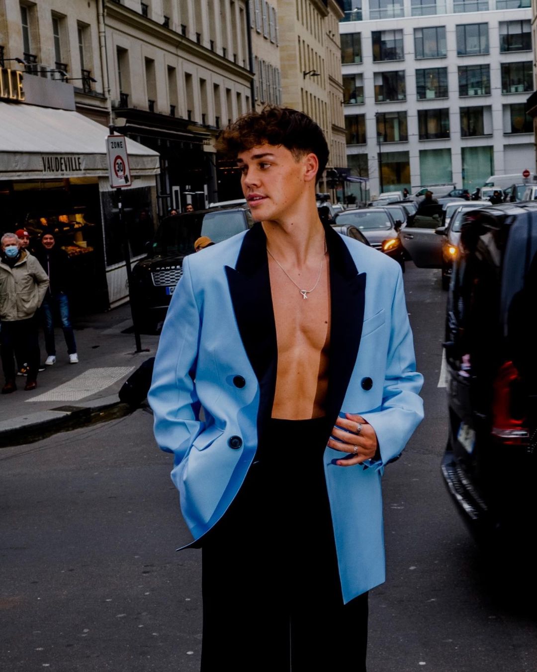 Noah Beck wearing high waisted jeans at AMI fashion show in Paris